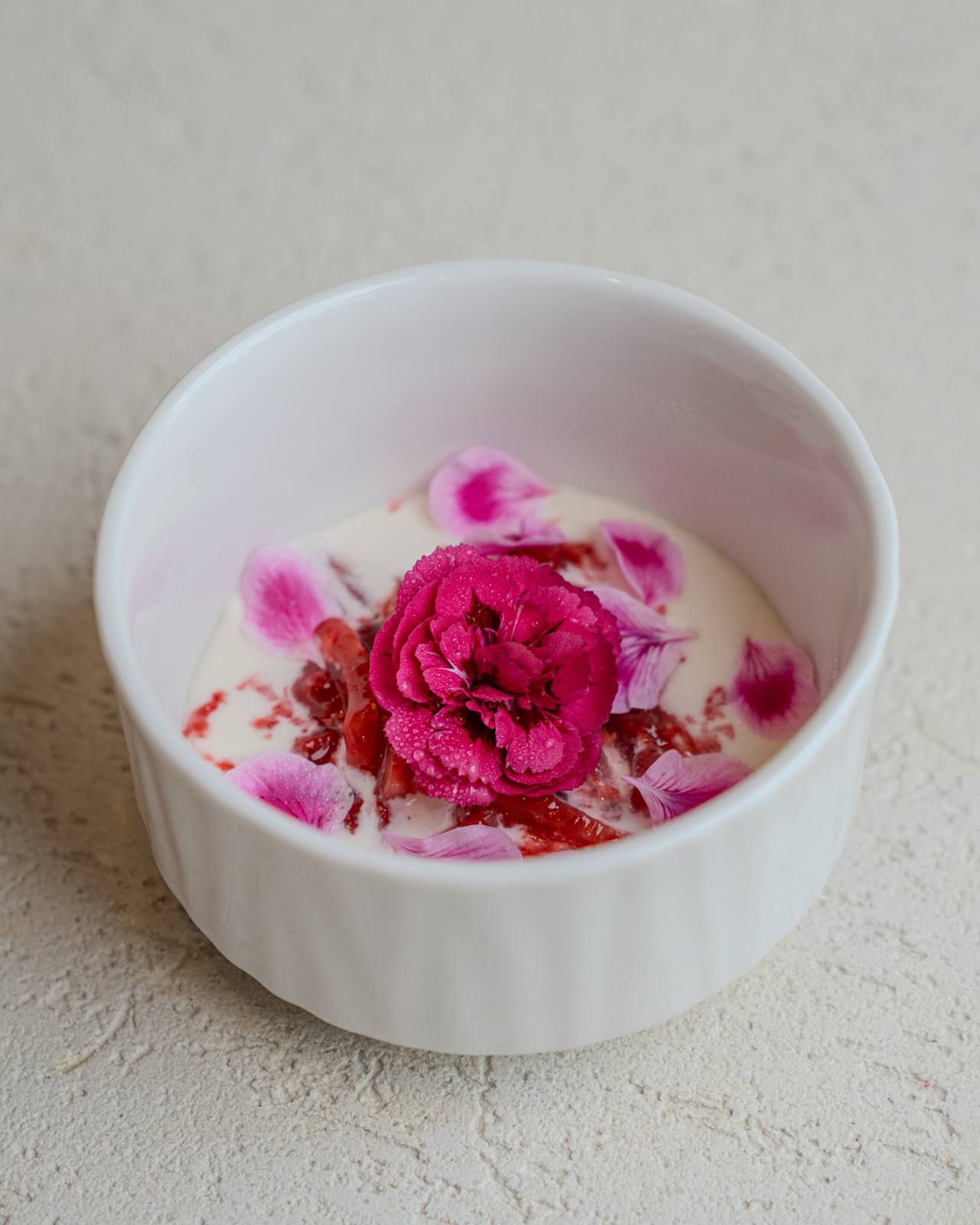Carnations over strawberries and cream